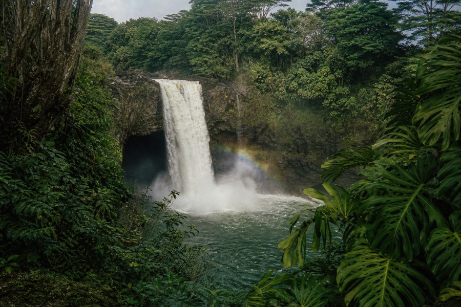 Rainbow Falls in Hilo with a rainbow forming in the mist